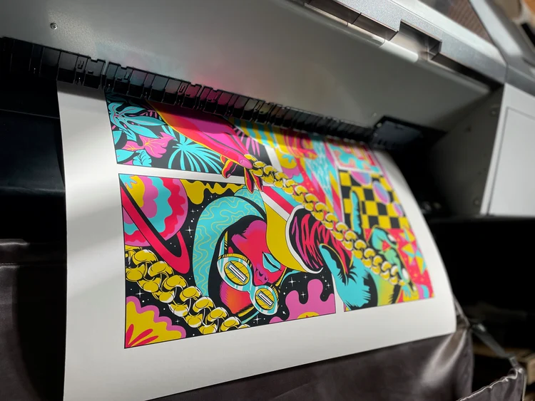Colourful artwork emerging from the Epson printer in our Bristol studio